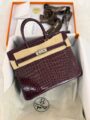 Hermes Birkin Bag in burgundy crocodile embossed finish with silver tone hardware