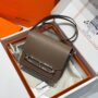 Hermes Mini Etoupe Bag with taupe brown exterior, silver-tone hardware and slim shoulder strap