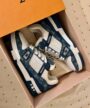 LV Trainer Blue Denim Sneakers with white textured panels and navy blue chunky soles